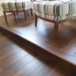 Raised wood flooring installation to add vertical interest to a floor